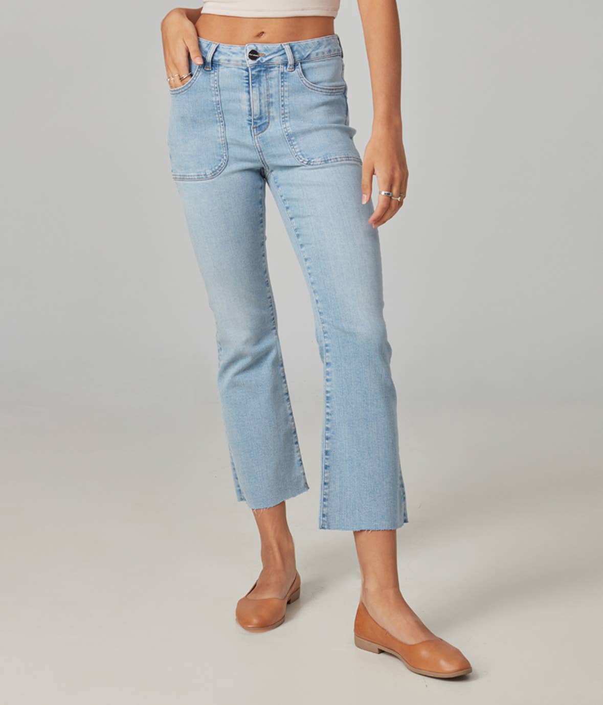 light wash high rise  jeans with front patch pockets and a cropped bootcut leg 
