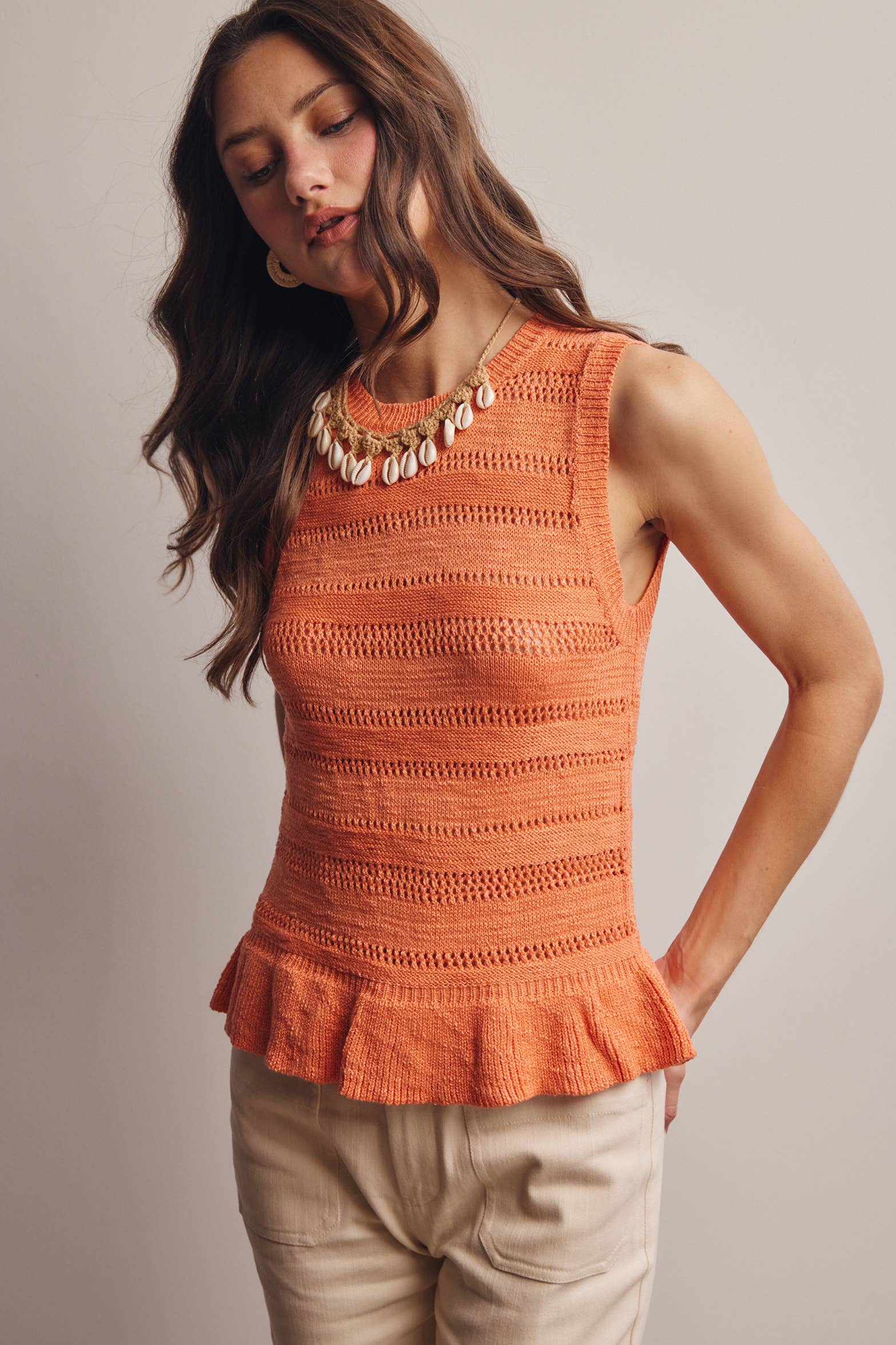 Sleeveless Pointelle Peplum Top